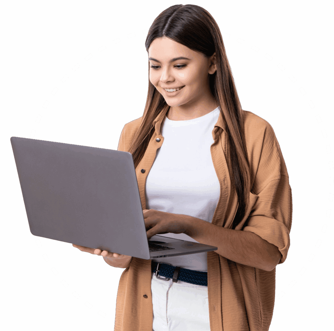 Woman smiling while using a laptop.