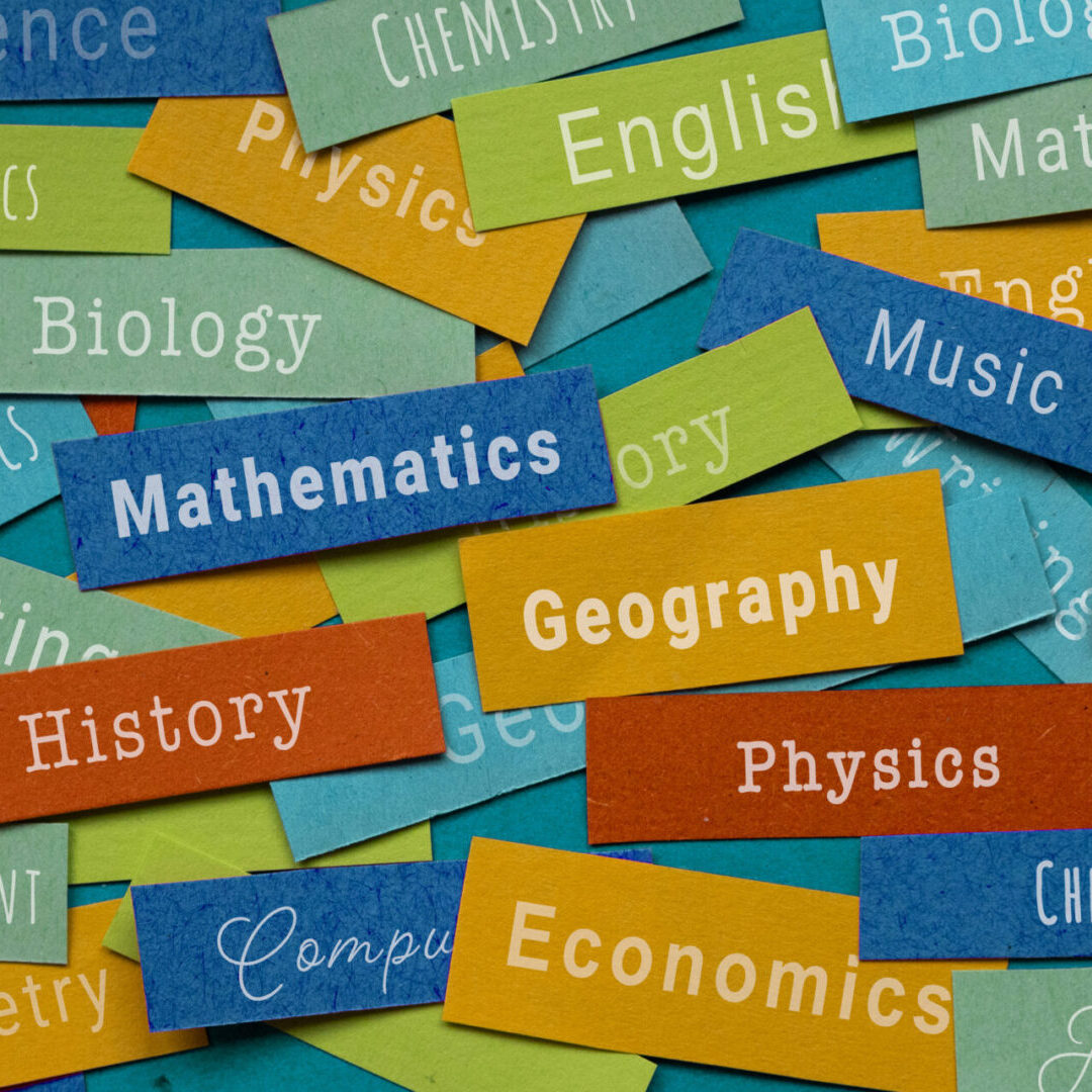 Colorful subject names on paper strips.